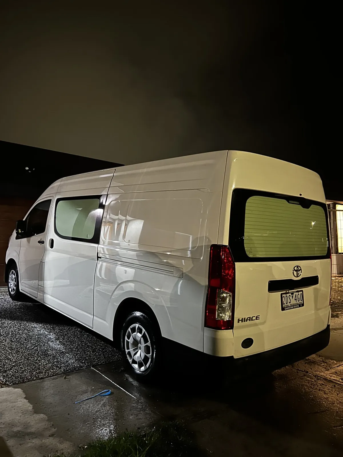 White Toyota HiAce van detailed rear three-quarter