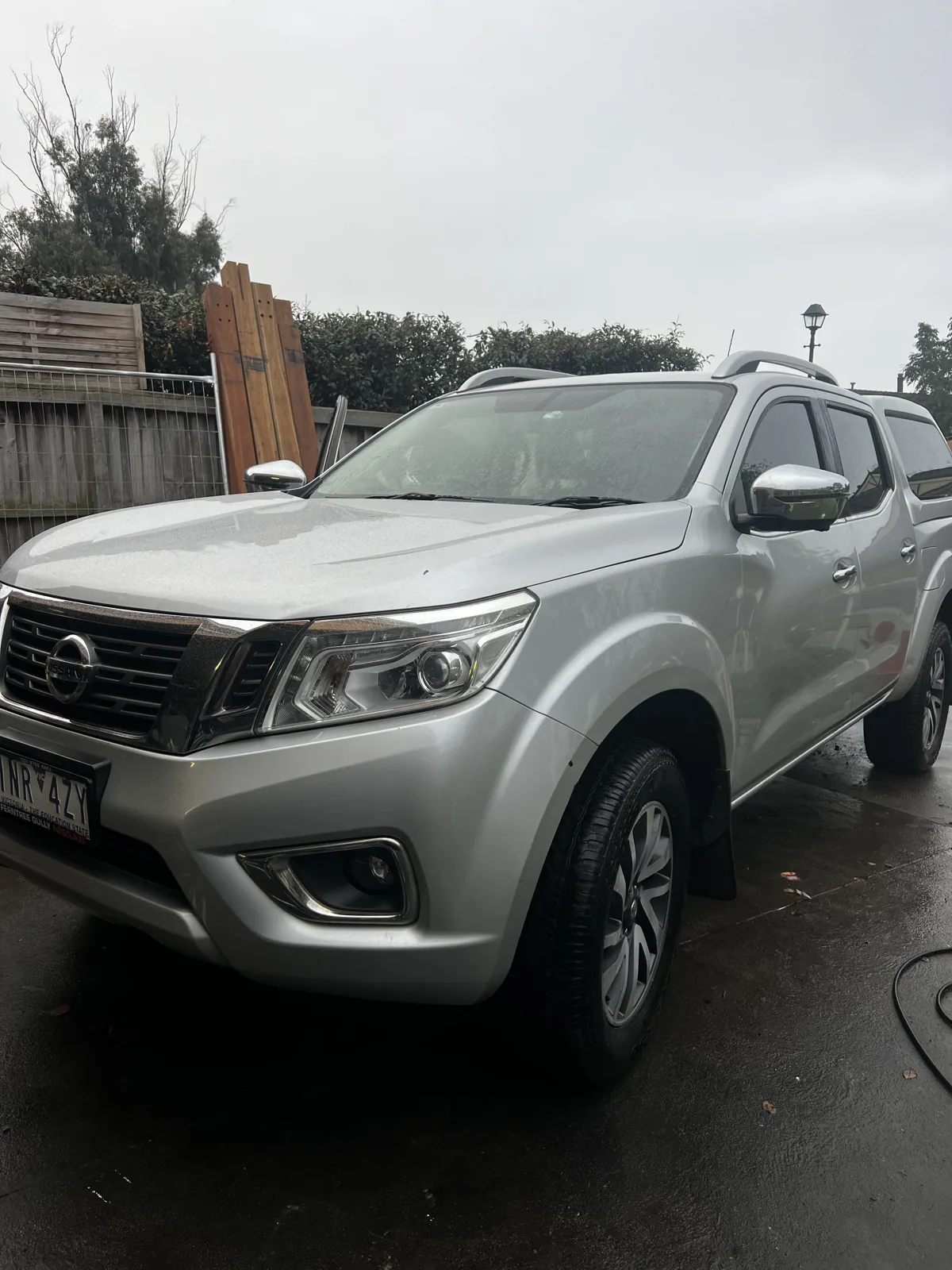 The same silver Nissan Navara washed and gleaming after a mobile detail