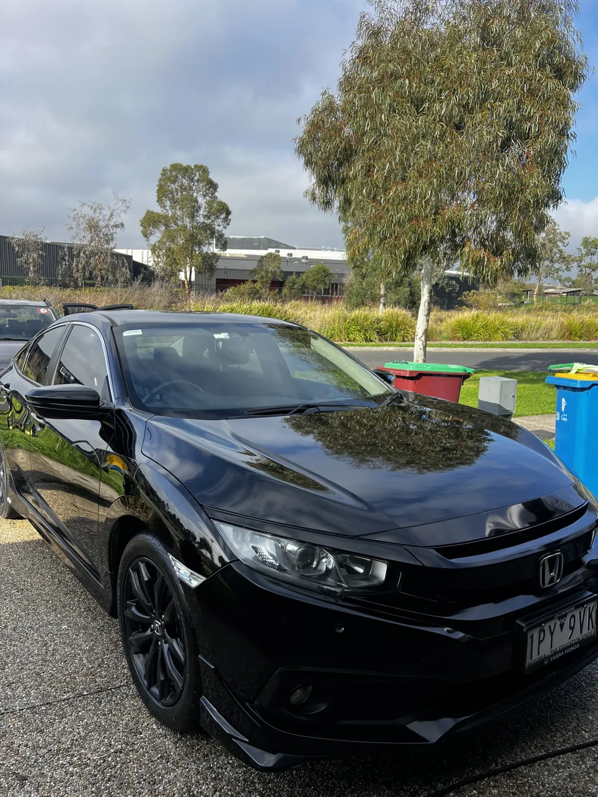 Black Honda Civic with a deep gloss ceramic-coated finish after paint protection