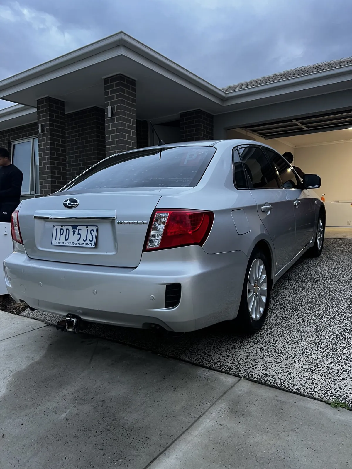 Silver Toyota sedan rear view after a full exterior detail