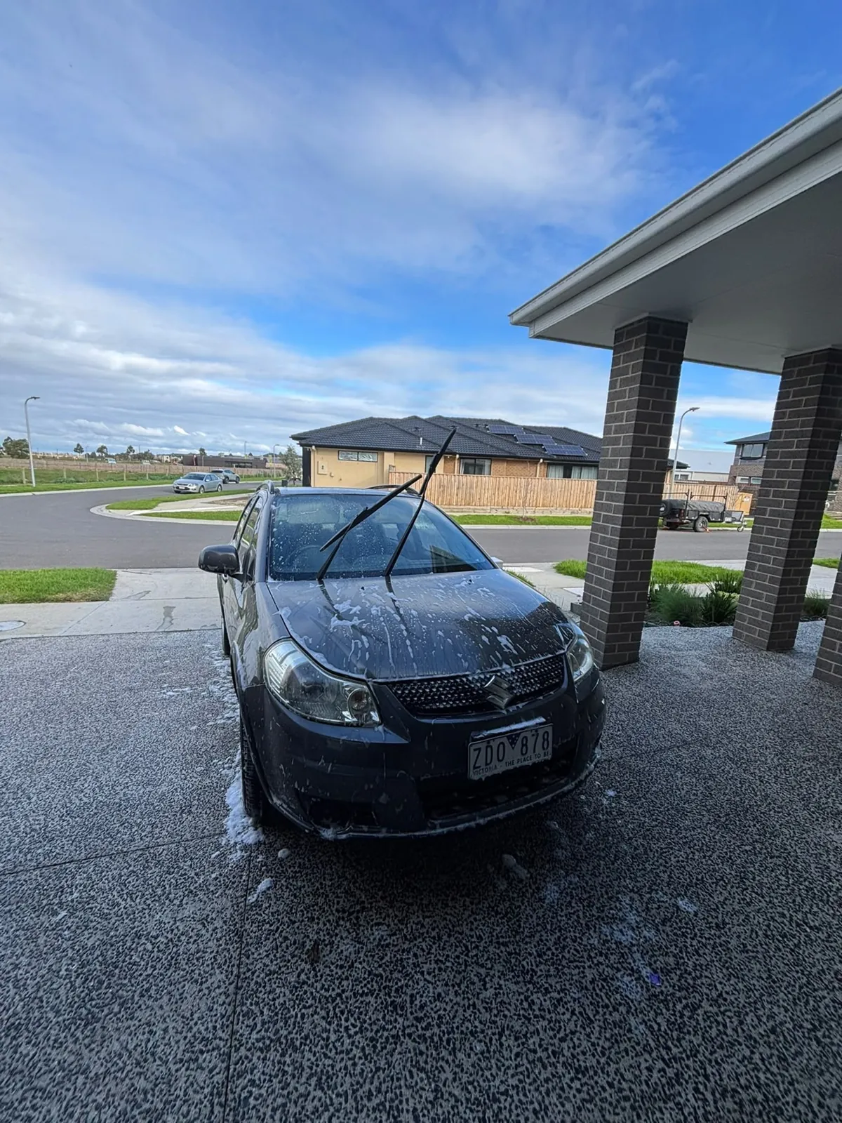 Blue Volkswagen hatch during a swirl-free maintenance wash